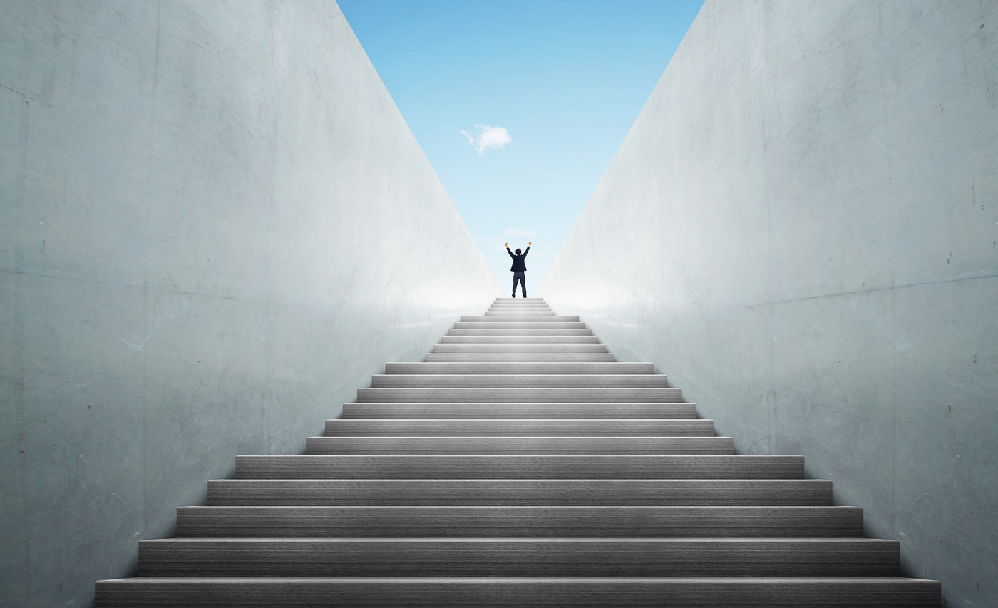 person going up stairs to make a strategic breakthrough